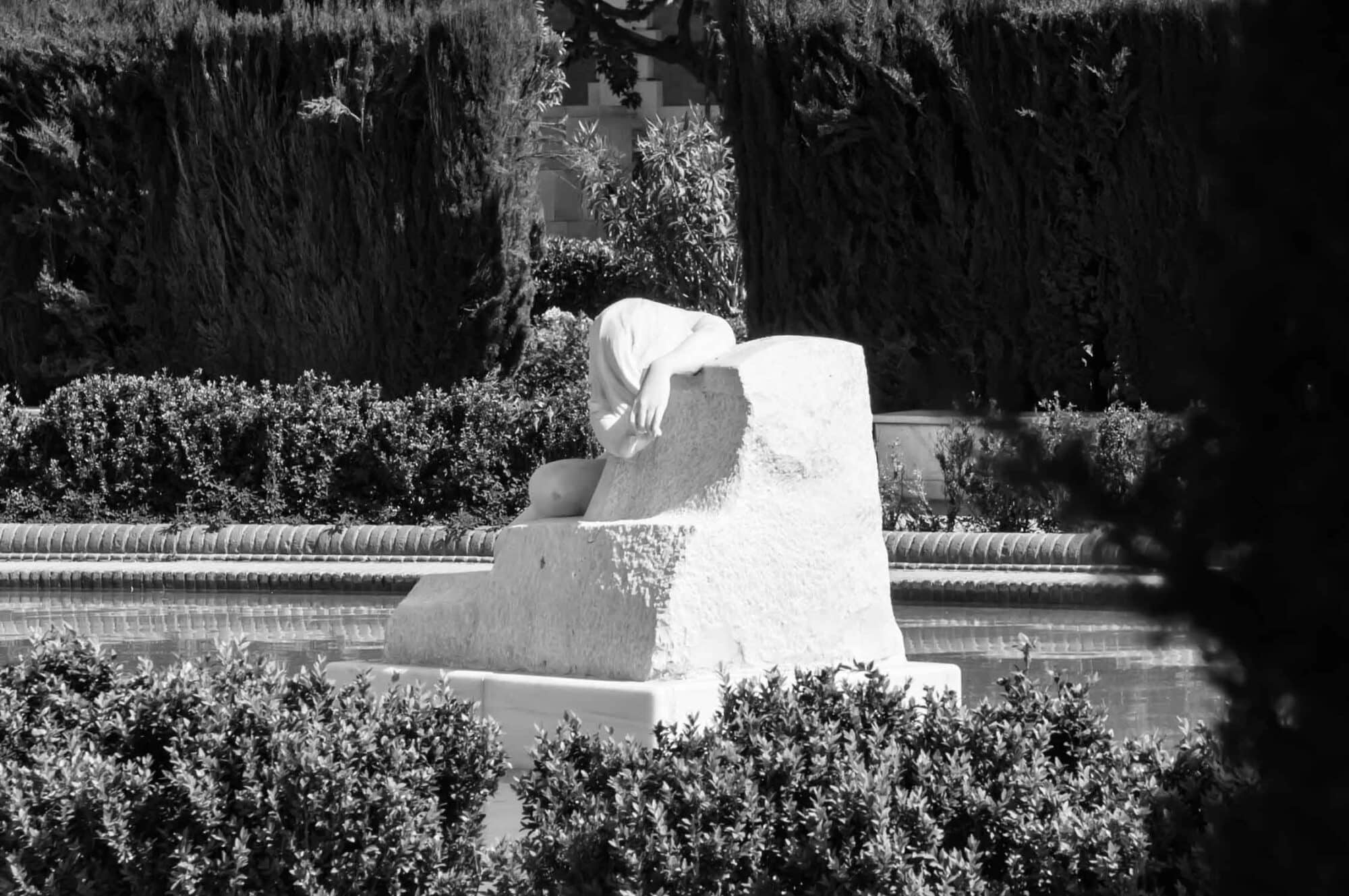 a statue of a women sleeping.