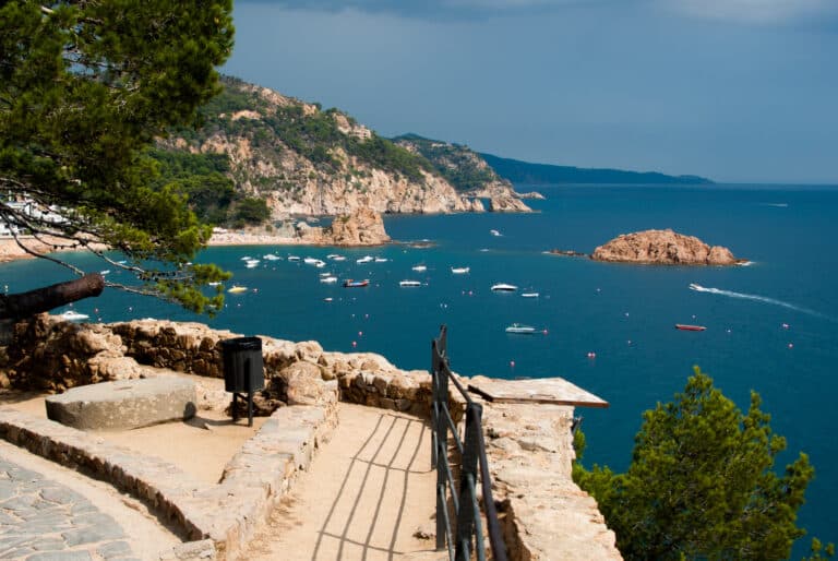 The walled Vila Vella of Tossa de Mar above the bay — private Costa Brava day trip from Barcelona.