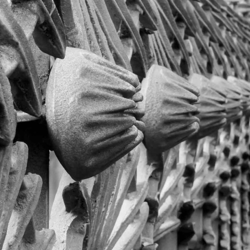 Details on an iron fence.