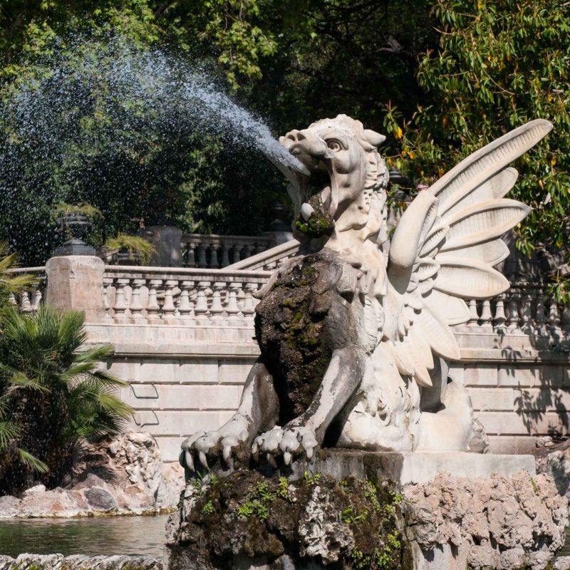 A griffon shooting water from its mouth.