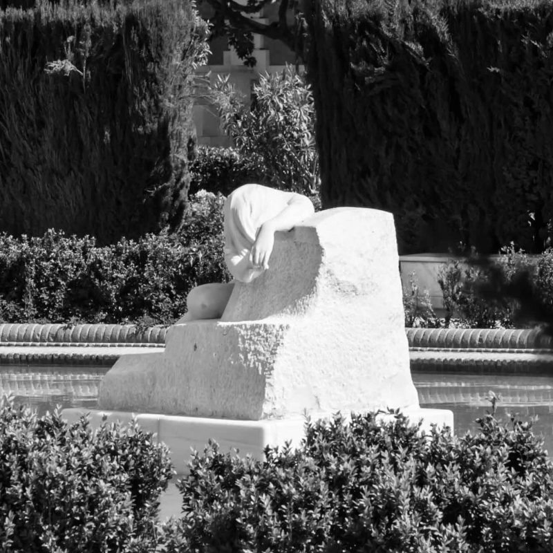 a statue of a women sleeping.