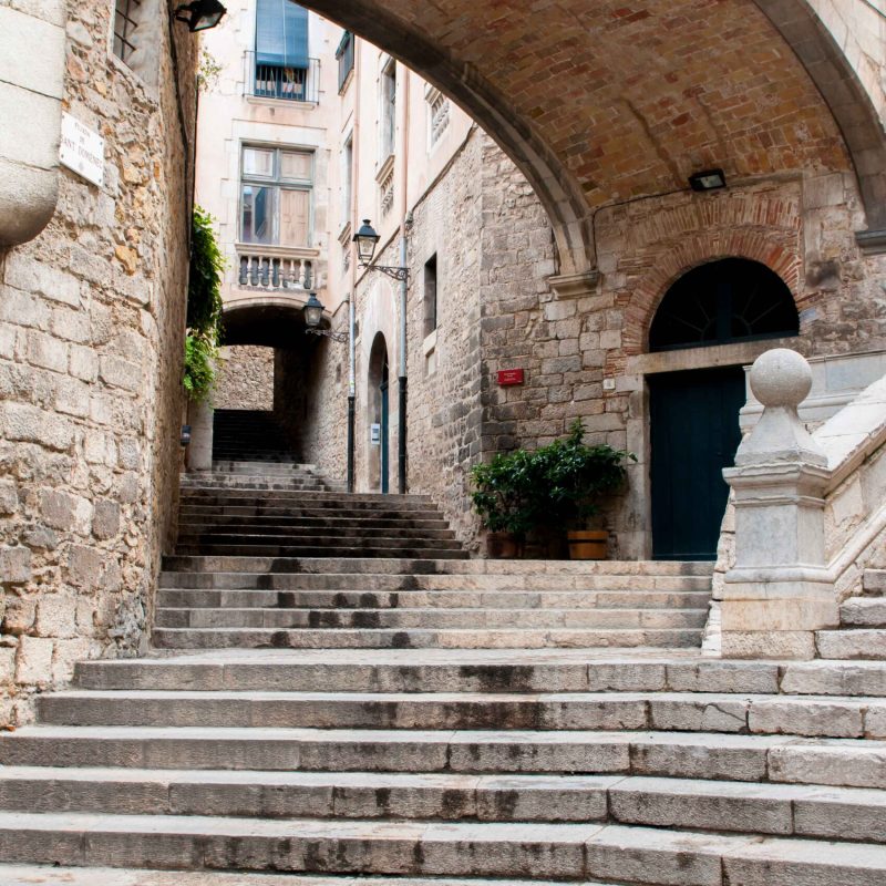 One of the narrow and stoned lined streets of Girona.