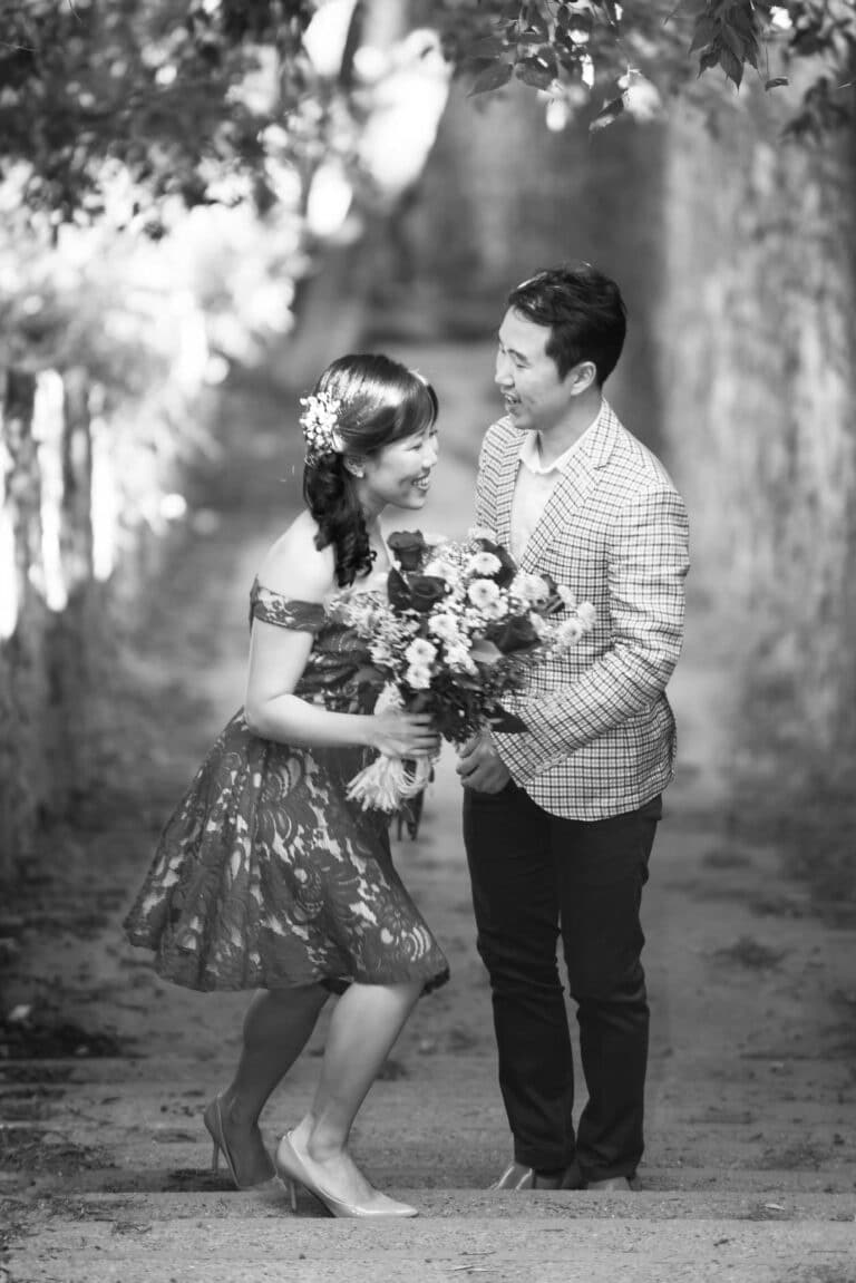 A couple on a stone staircase in el carmel park in Barcelona during their couples photo session.