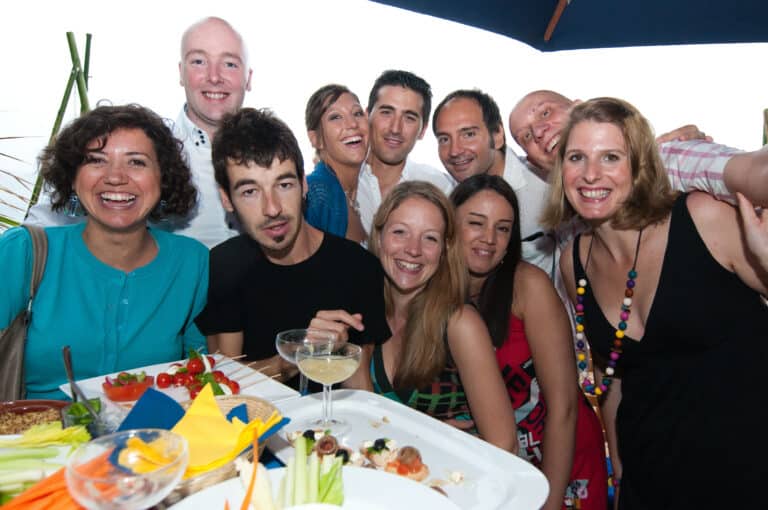 A group of friends posing for a picture at this reception event.