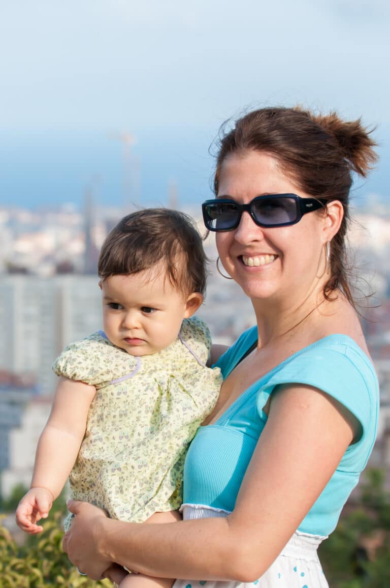 Mom and baby overlooking the city of Barcelona.