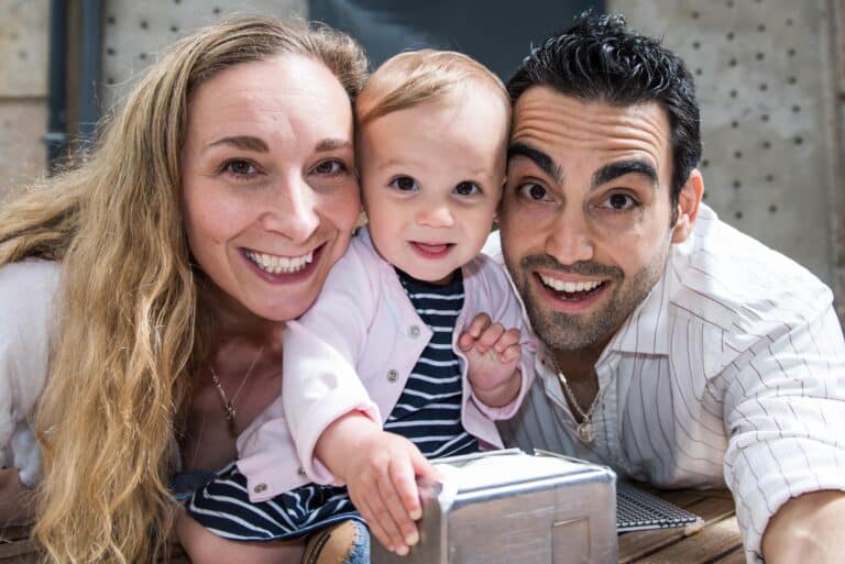 A break for coffee turns into a nice photo opportunity for this mom, dad and baby girl.