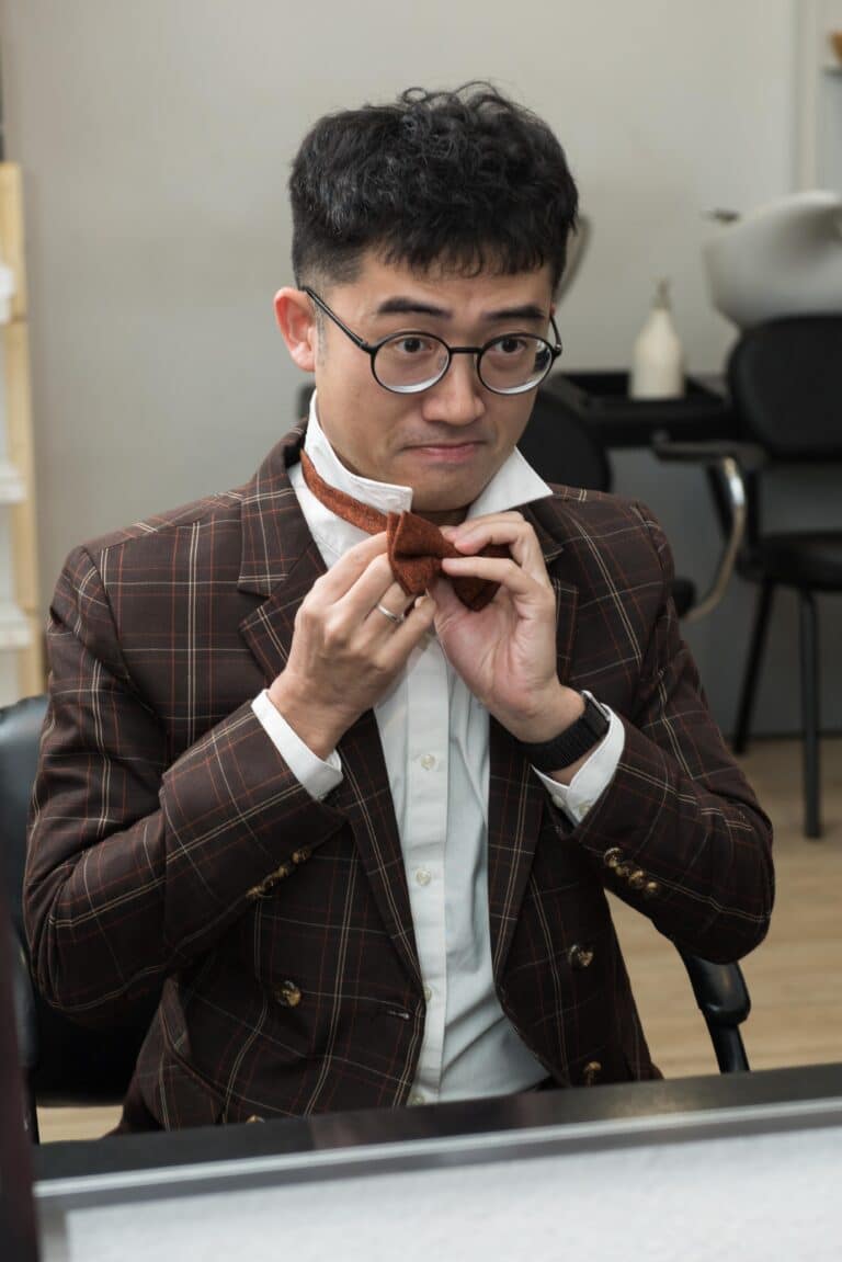 Fixing his bow time at while getting ready for his pre wedding photo session.