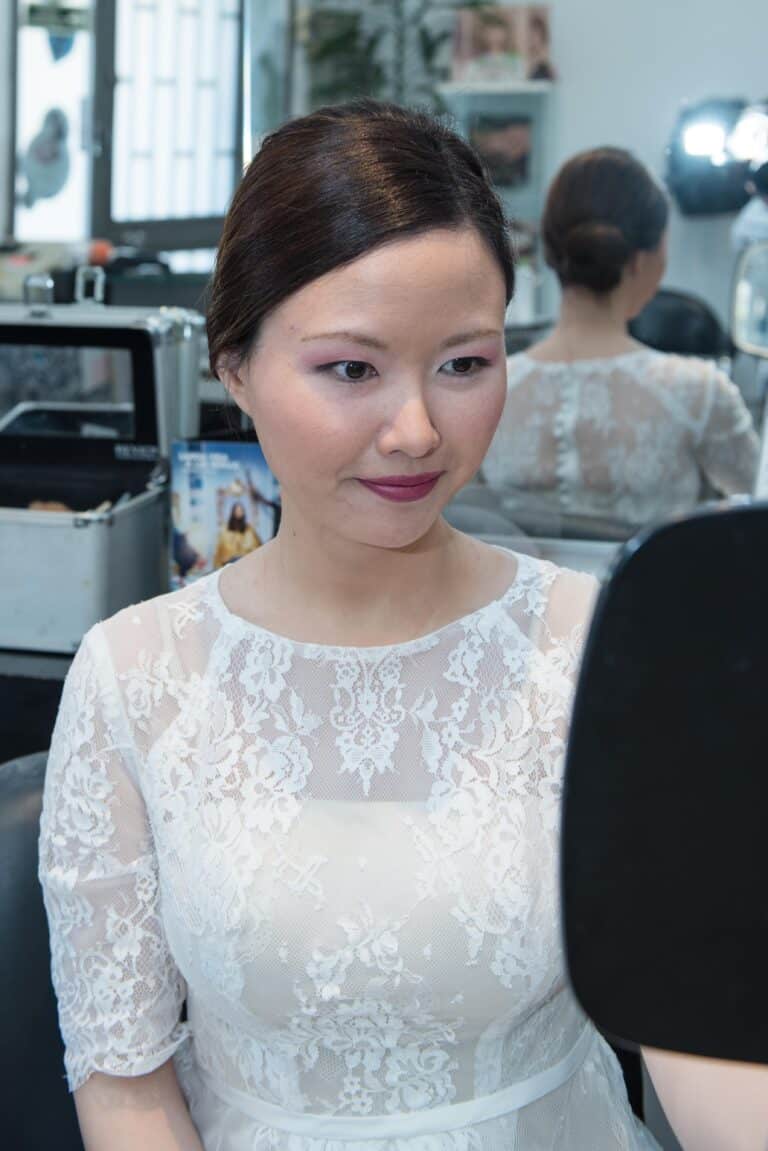 Checking her look at the hair salon before her couples photo session.